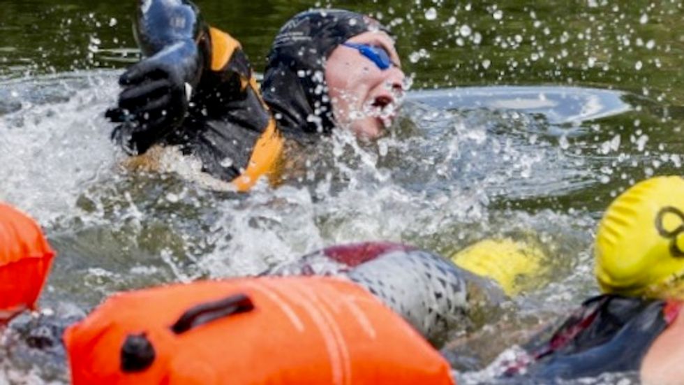 Dutchman swims epic ice-skating course threatened by climate change