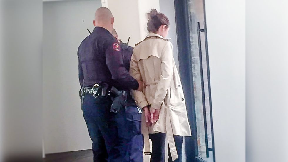 WATCH: Woman arrested for speaking out at Mitch McConnell's swanky closed-door luncheon
