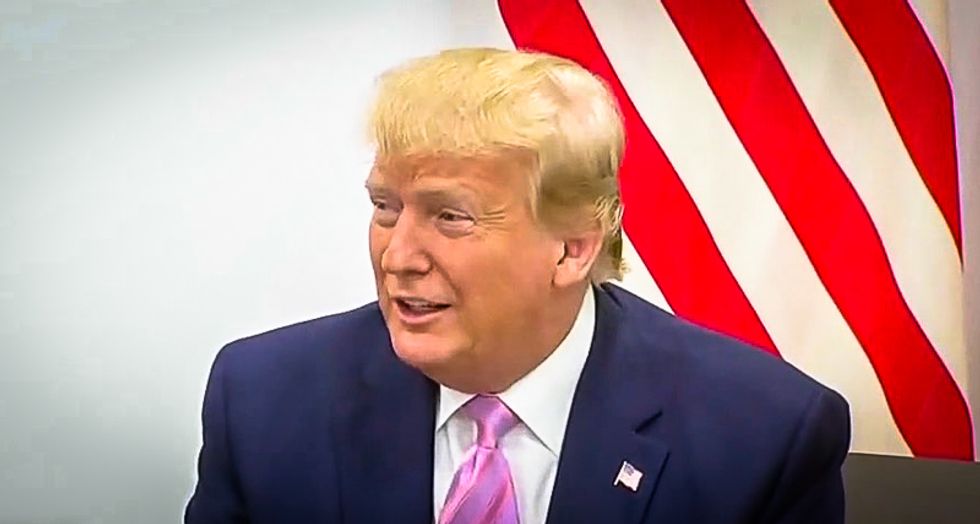 Trump shrugs at Vladimir Putin and says 'don't meddle in the election' at Osaka meeting