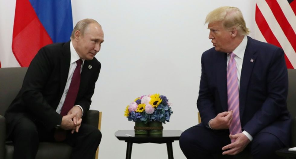 With a smile, Trump playfully tells Putin 'don't meddle in the election'