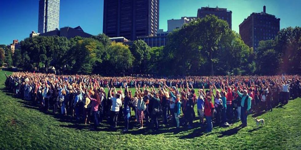 2,000 people (including me) form a human peace sign for John Lennon's birthday in Central Park and try to break a world record