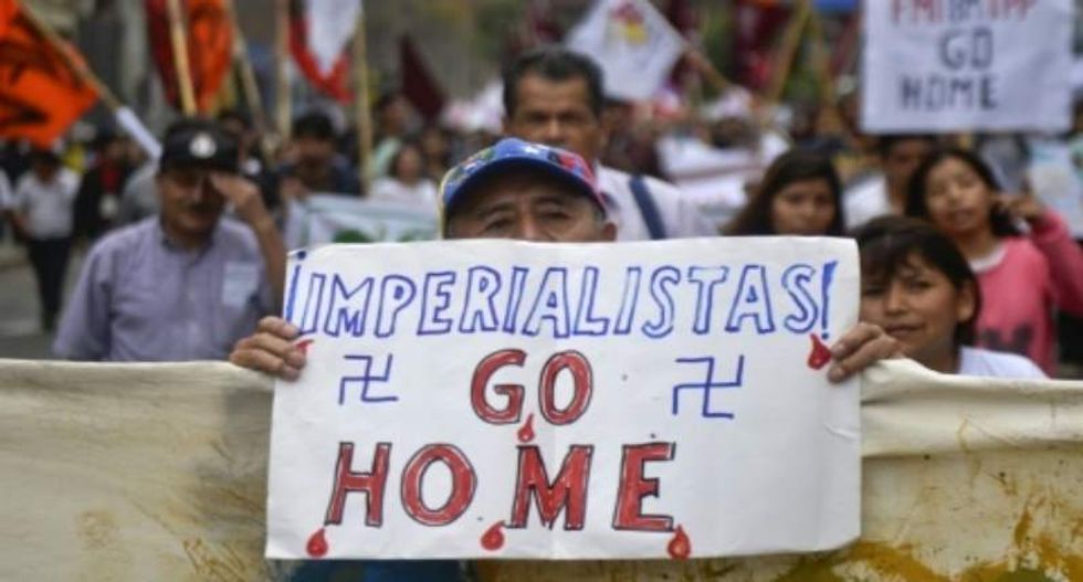 Protesters march against World Bank 'imperialists' during annual meeting in Peru