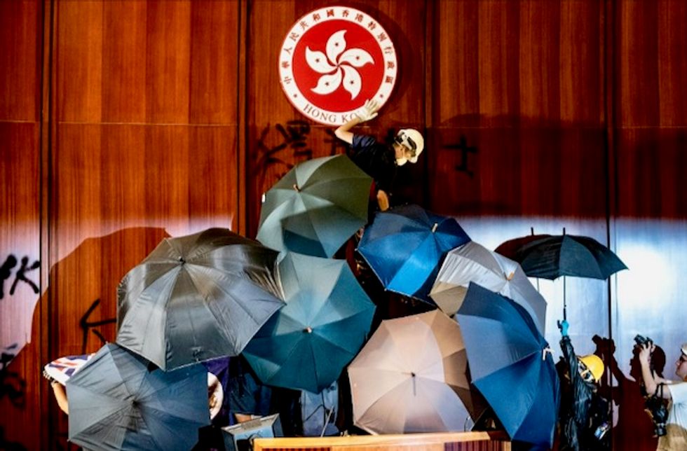 Hand signals and shields: How Hong Kong’s parliament was stormed