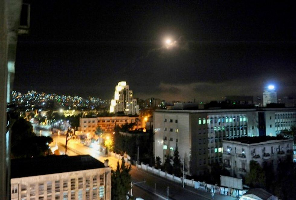 Waking to blasts, Damascus residents defiant after Western strikes