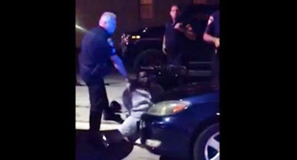 WATCH: Baltimore cop suspended for spitting in handcuffed black man's face -- then charging him with assault