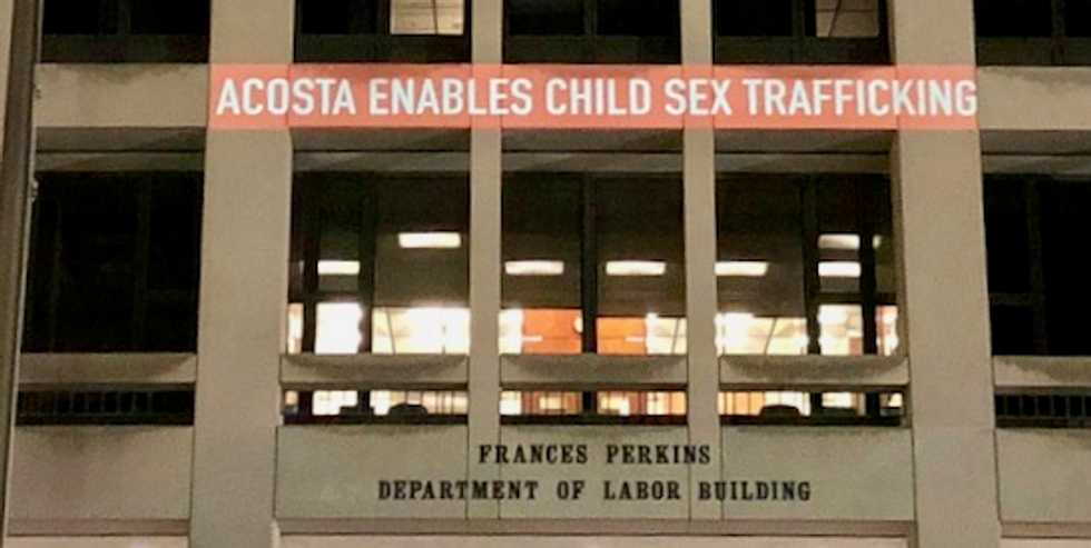 'Acosta Enables Sex Trafficking' projected onto Department of Labor building as resignation demands grow
