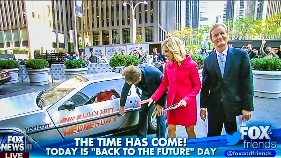 Huey Lewis watches in shock as Fox host gets trapped in the ‘Back to the Future’ DeLorean on live TV