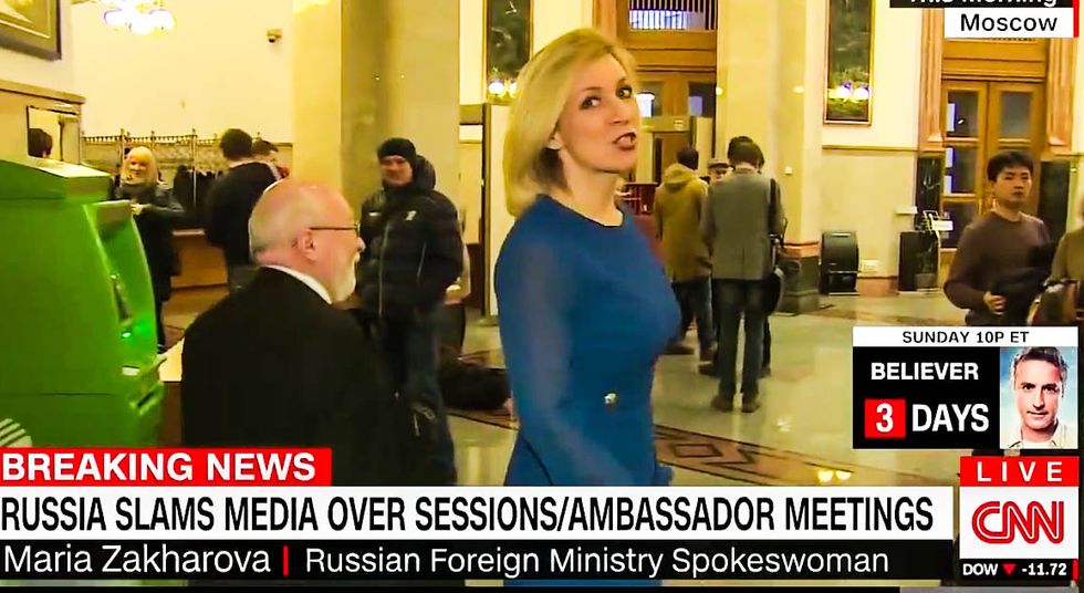 WATCH: Russian official rants about fake news while fleeing CNN questions about Trump