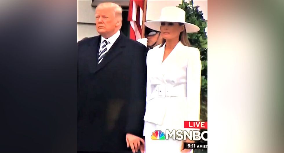 WATCH: Melania awkwardly tries to avoid letting Trump hold her hand at White House ceremony