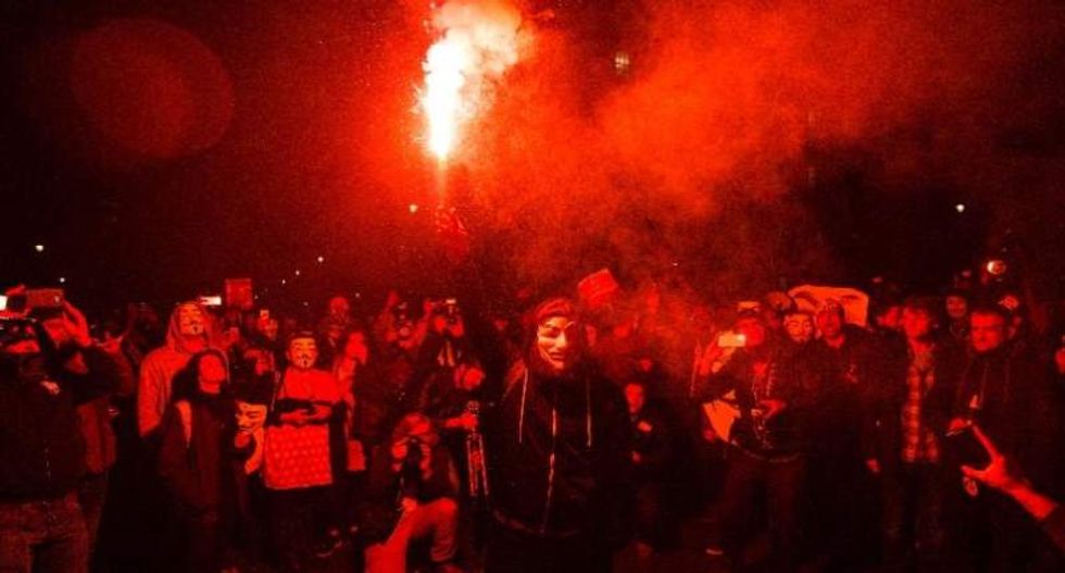 Police and protesters clash during 'Million Mask March' against capitalism in London