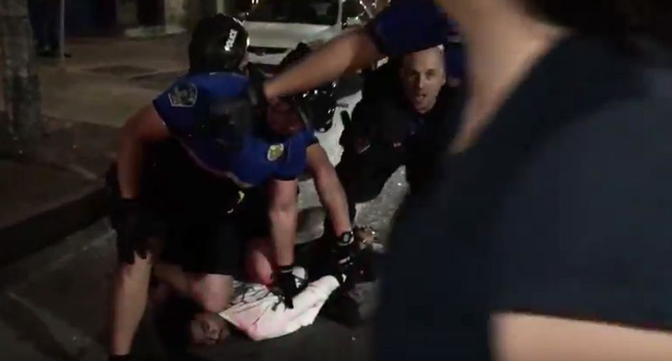 WATCH: Mob of Austin cops tackle and assault two unarmed men for jaywalking