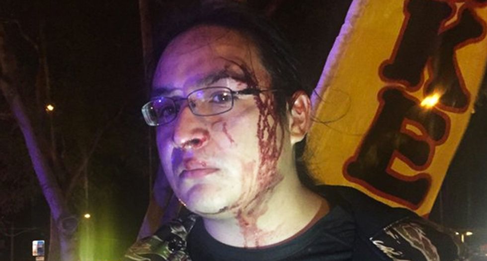 WATCH: Arizona cops assault unarmed man for pulling out his phone during profiling stop