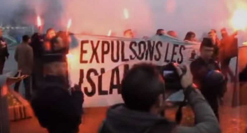 WATCH: French mourners angrily chase off right-wing anti-Muslim bigots invading vigil