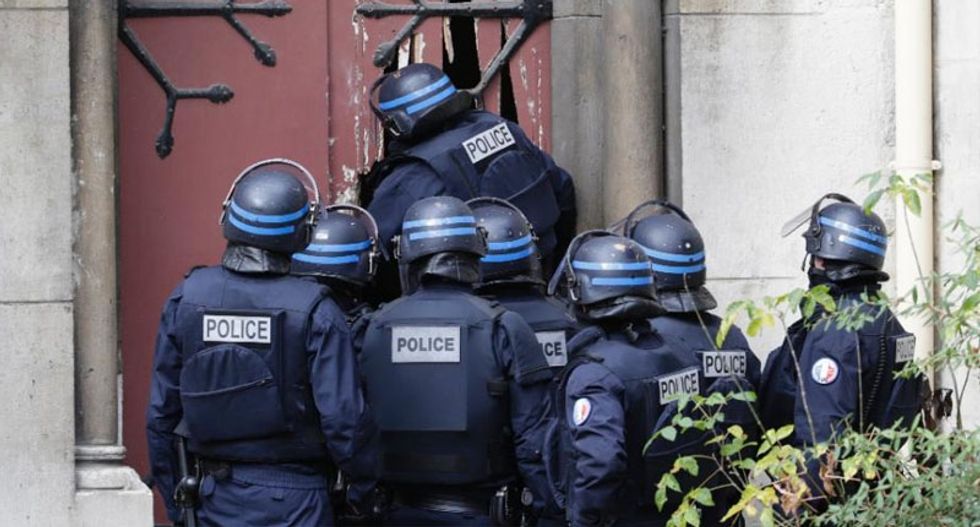 Paris outskirts a 'war zone' as police stage massive raid
