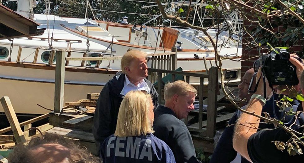 ‘At least you got a nice boat’: Trump jokes about state of Hurricane Florence flood victim's damaged house