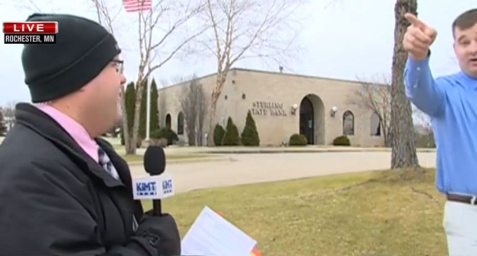 Live report on bank robbery interrupted when suspect runs by