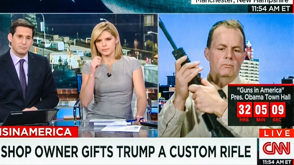 'Really?': Trump-loving gun shop owner shocks CNN hosts by cradling AR-15 for entire bizarre interview