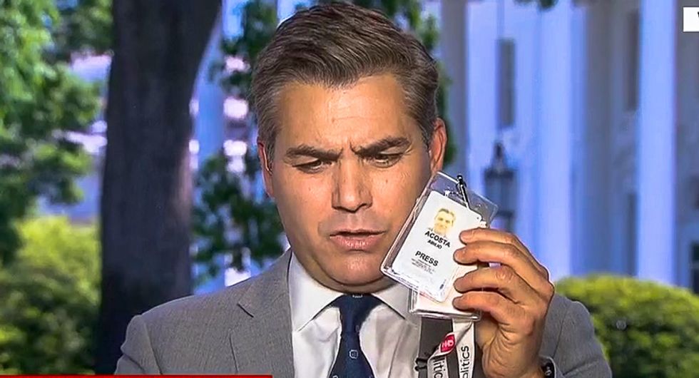 White House suspends Jim Acosta's press credentials — and made it sound like he assaulted a 'young woman'