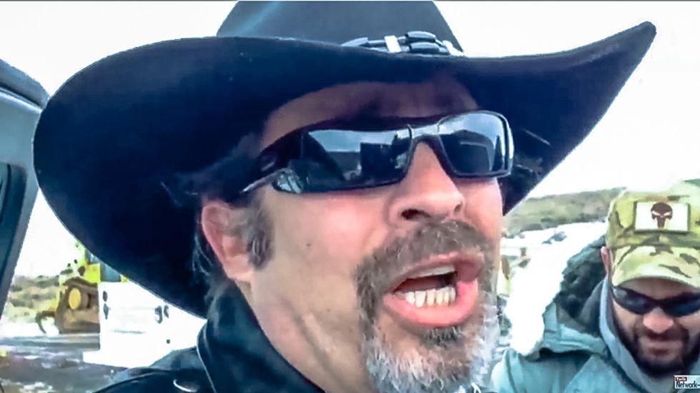 Militant broadcaster brands 15-year-old girl a 'prostitute' for crying in fear at Oregon town meeting