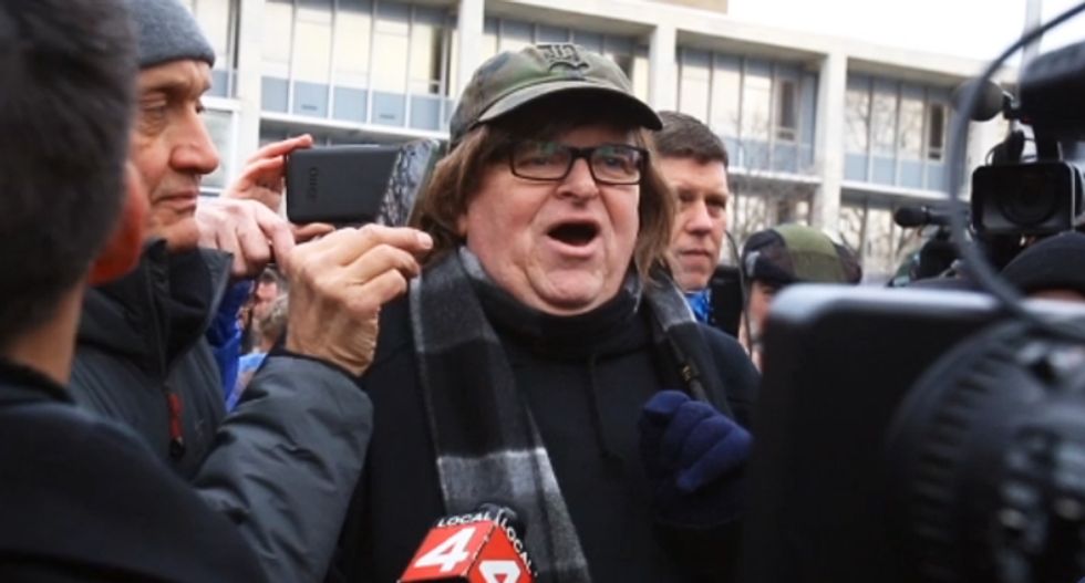 Michigan militia group backs Michael Moore’s campaign to hold officials accountable for Flint crisis