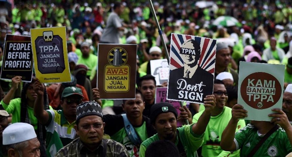 Despite protests, US and 11 other countries officially sign Trans-Pacific Partnership trade deal