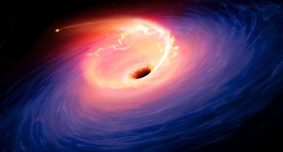 Astronomers piece together first image of black hole