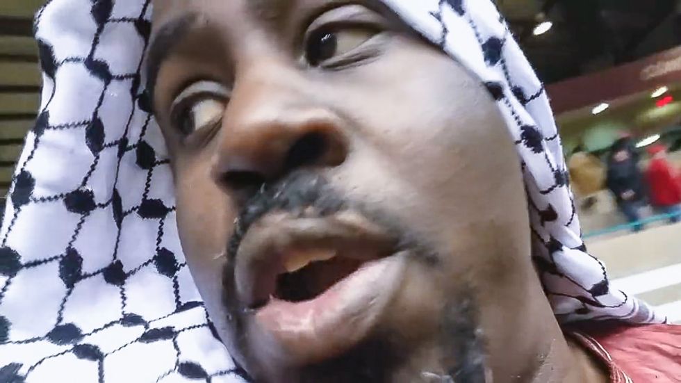 'You are no longer welcome': Cops at Trump event boot peaceful black professor wearing headscarf