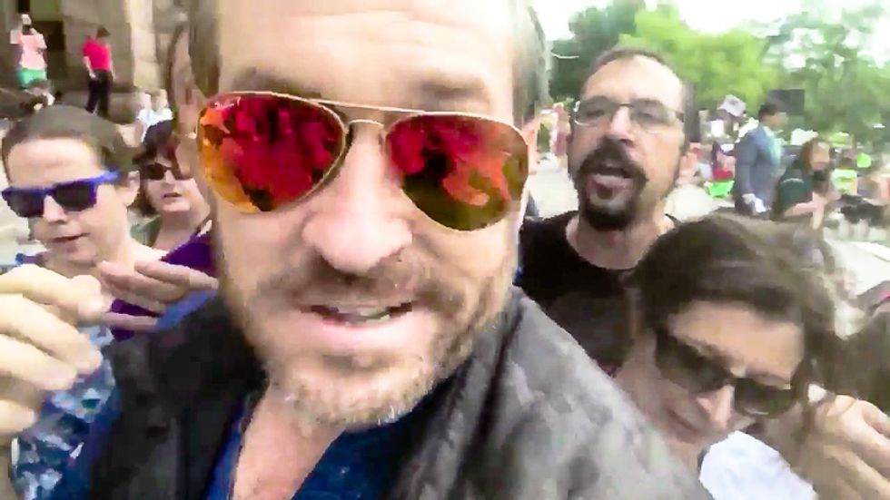 Alt-right's Mike Cernovich gets 'punched in the face' while yelling 'Clinton is a rapist' at anti-Trump rally