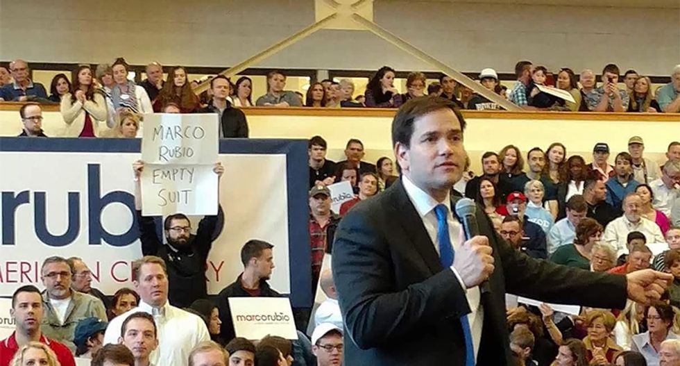 Protester at Marco Rubio's rally got roughed up for holding an 'empty suit' sign