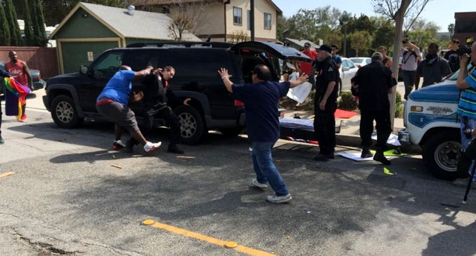 'Violence is not acceptable': Police hunt for suspect in Anaheim KKK stabbings