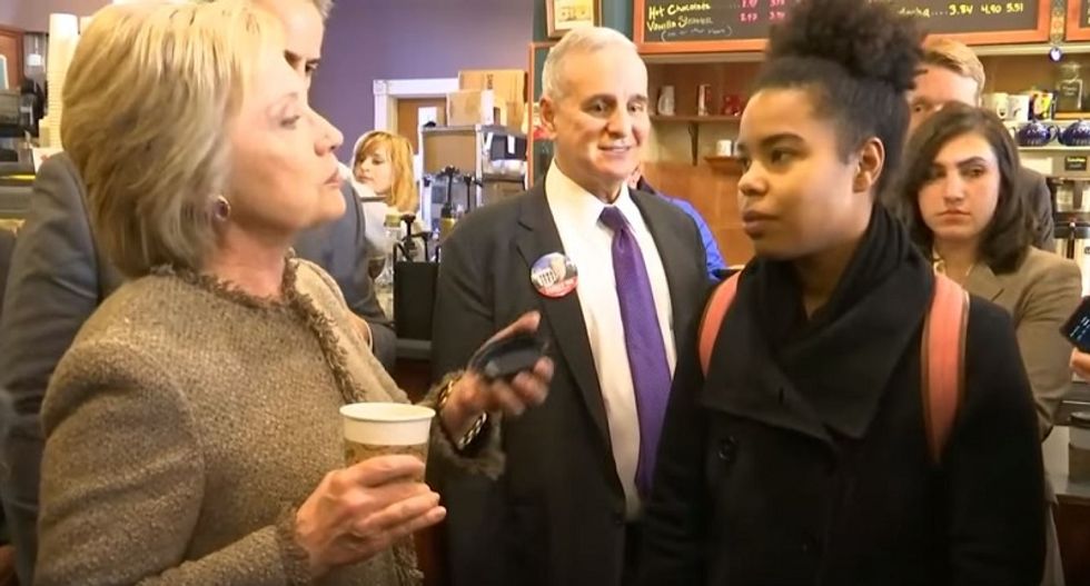 Young voter challenging Clinton on African-American issues is dismissed and ushered out by aides
