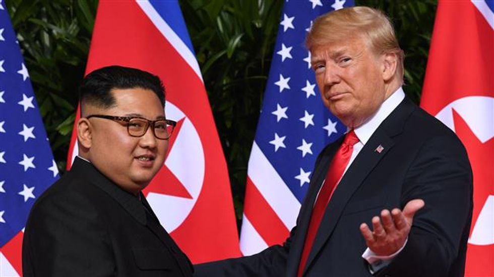 Trump replaces White House photos of French president with framed pictures of Kim Jong-un
