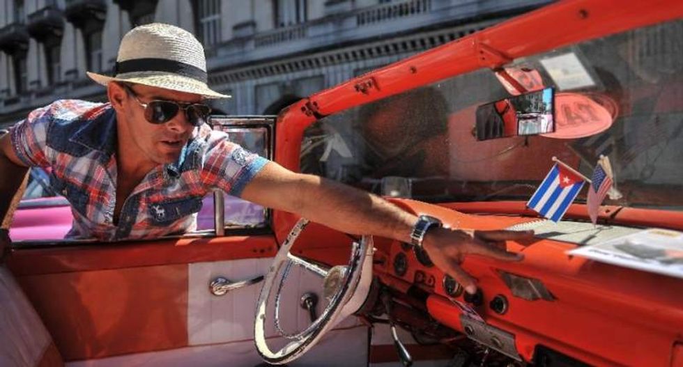 White House expands tourists' access to Cuba as Obama visit draws near