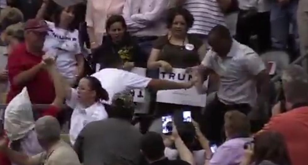 More violence at Trump rally as man is caught punching and stomping a protester