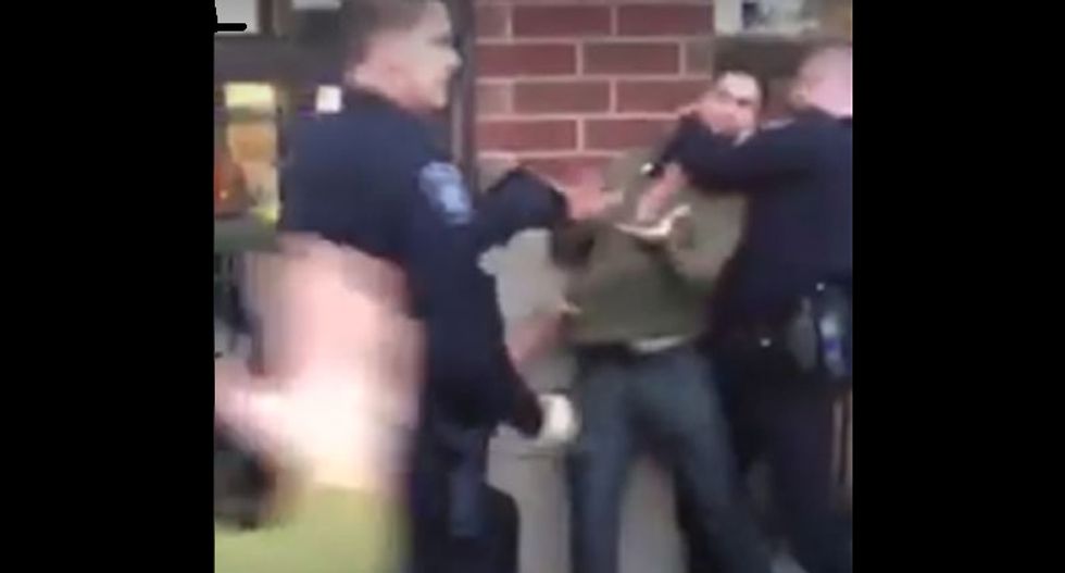 WATCH: Mob of cops violently gang-tackle and Taser unresisting man outside Michigan bar