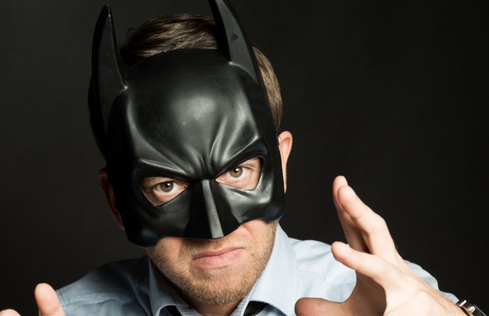 Box cutter-wielding 'Batman' arrested after dancing with a KKK doll at LA City Council meeting