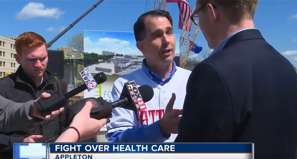 WATCH: Scott Walker blows up at county exec for asking about people losing health care instead of tourism