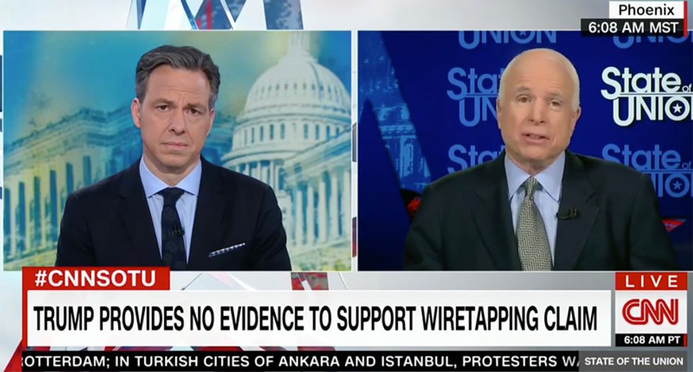 'The president has a unique style': MCain defends Trump promoting conspiracy theories