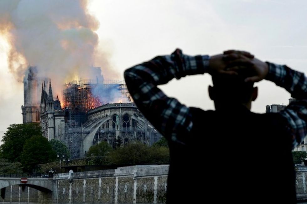 'Paris is disfigured': Tears and shock as Notre-Dame burns