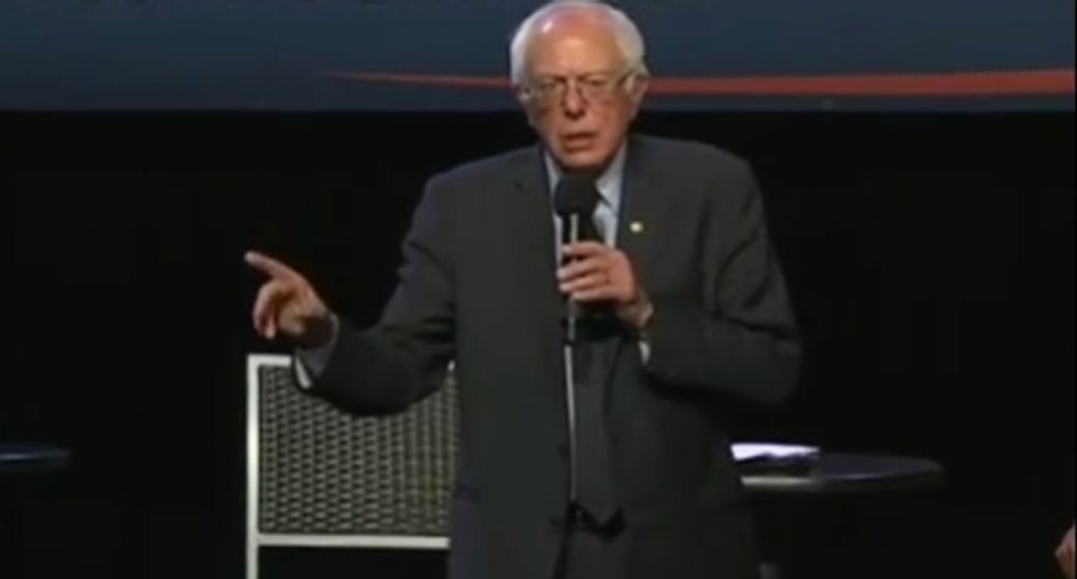 WATCH: Bernie Sanders smacks down man ranting about 'Zionist Jew' bankers at Harlem rally