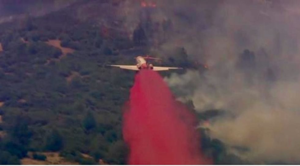 California fire threatens 600 buildings after thousands evacuated