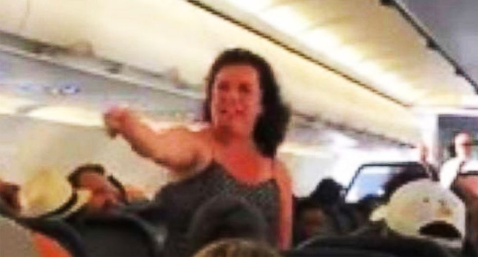 WATCH: Police called after woman has profanity-laced meltdown on flight diverted for medical emergency
