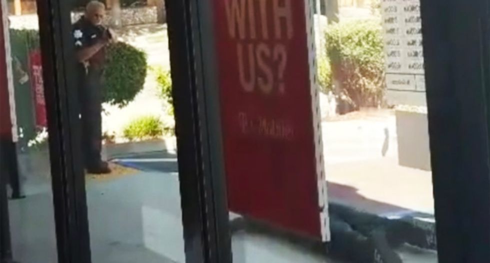 WATCH: Fresno cops make black men crawl at gunpoint after T-Mobile employees falsely accuse them of burglary