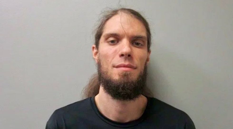 Crowd drops to ground as 'lunatic' Trump supporter pulls gun on peaceful immigration protest in Alabama