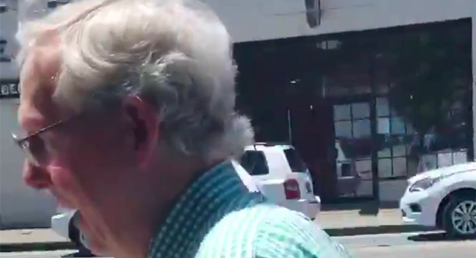 WATCH: Protestors confront Mitch McConnell as he leaves Louisville restaurant with chants of 'vote you out'