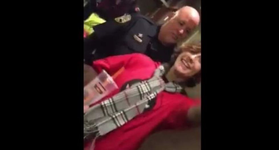 Cops caught on video harassing lesbian inside womens' bathroom thinking she's a man