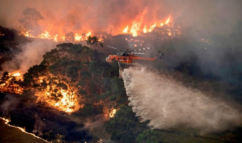 Thousands to sleep at beaches as fires encircle Australian towns