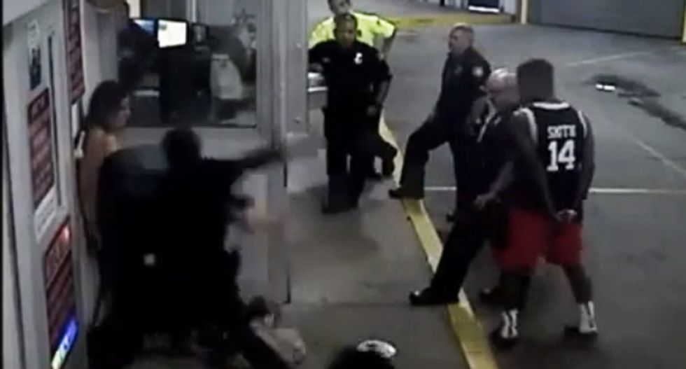 WATCH: Rookie cop brutally beats handcuffed woman pinned to wall -- as other officers watch