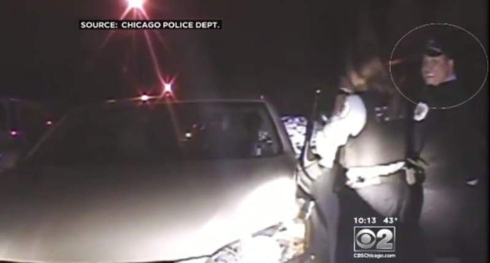 Dashcam video shows Chicago cop smiling while attacking reverend with kids in her car