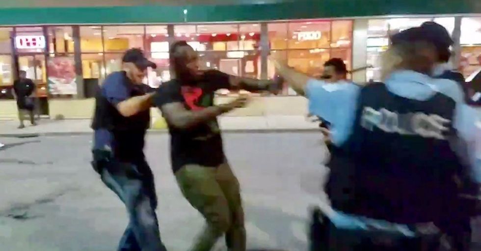 Watch: Chicago cops beat protestors and reporter with batons after being pelted with bottles where police killed black man